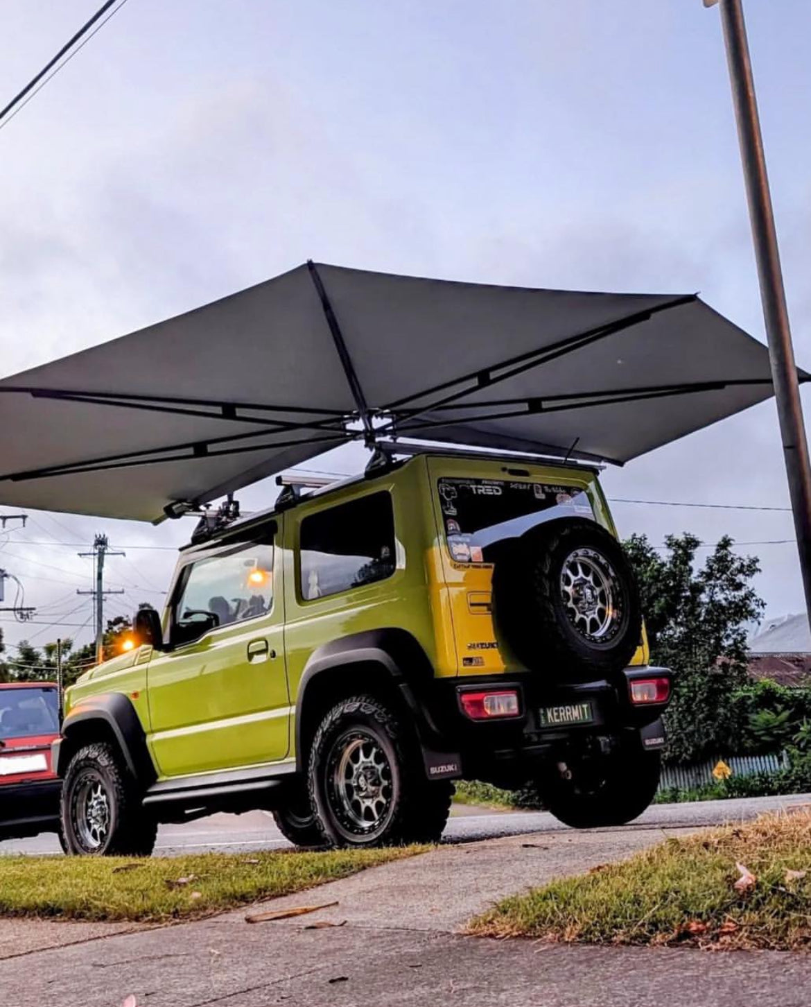 Kinetic Yellow Jimny with Bluish Black Pearl awning 4x4